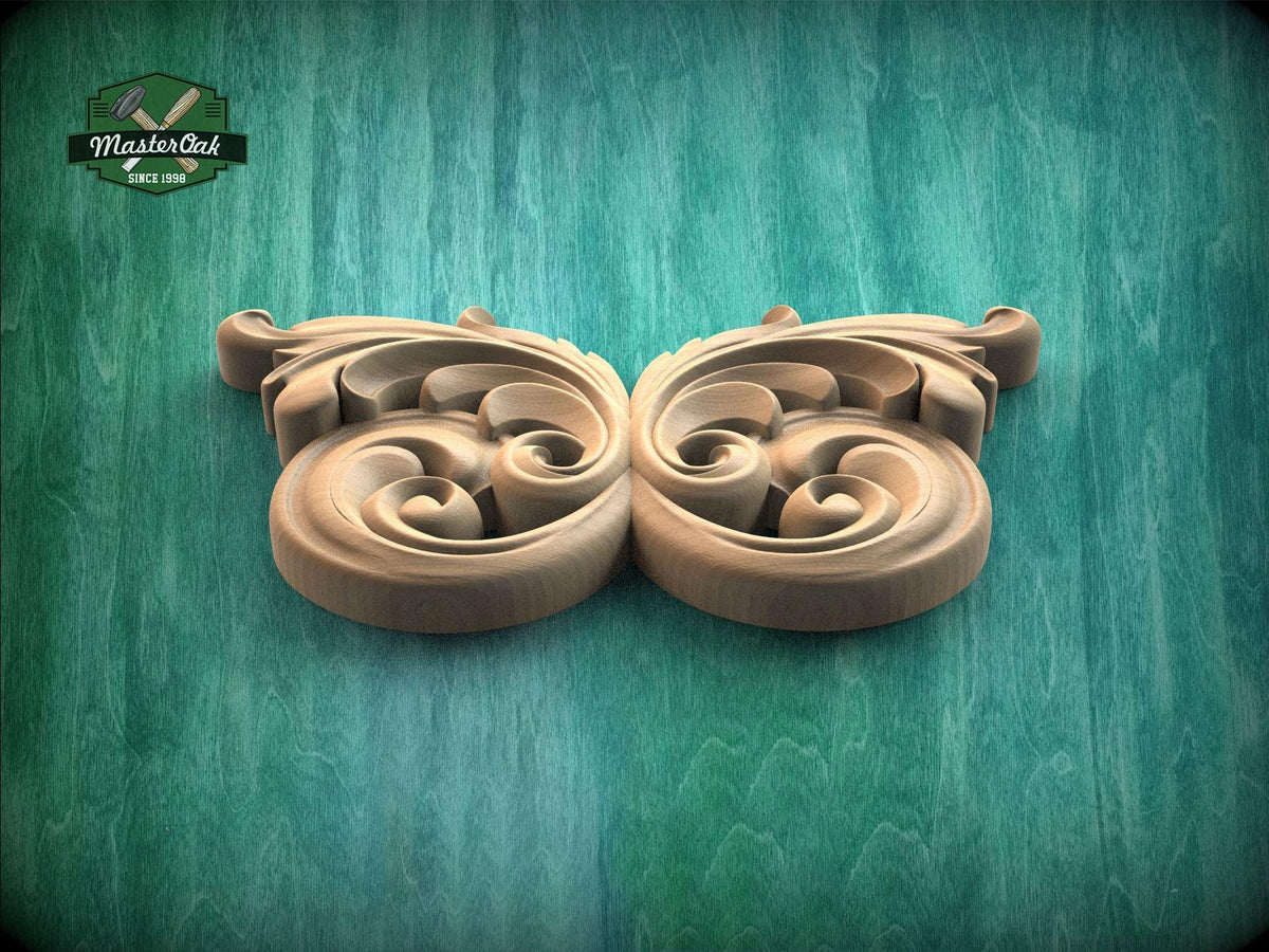 A decorative wooden carving with intricate scrollwork is displayed against a green background.