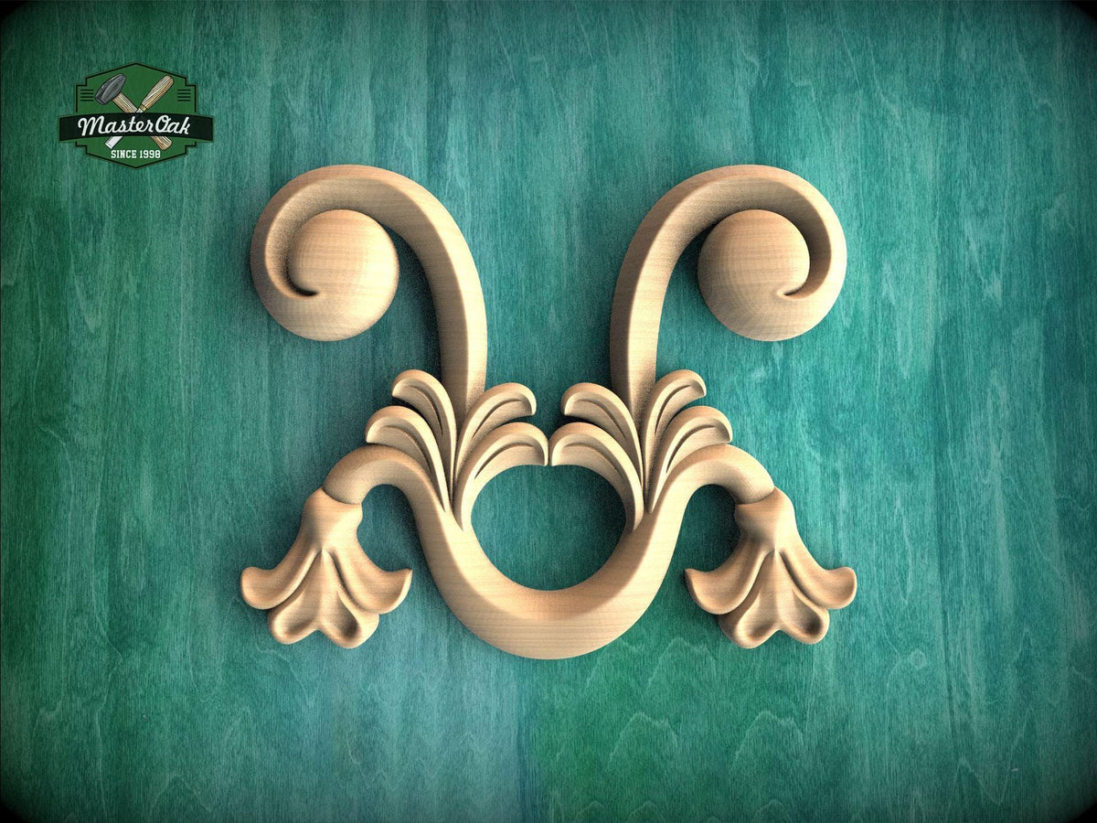 A decorative wooden carving with two curved, flower-like elements is displayed against a green background.