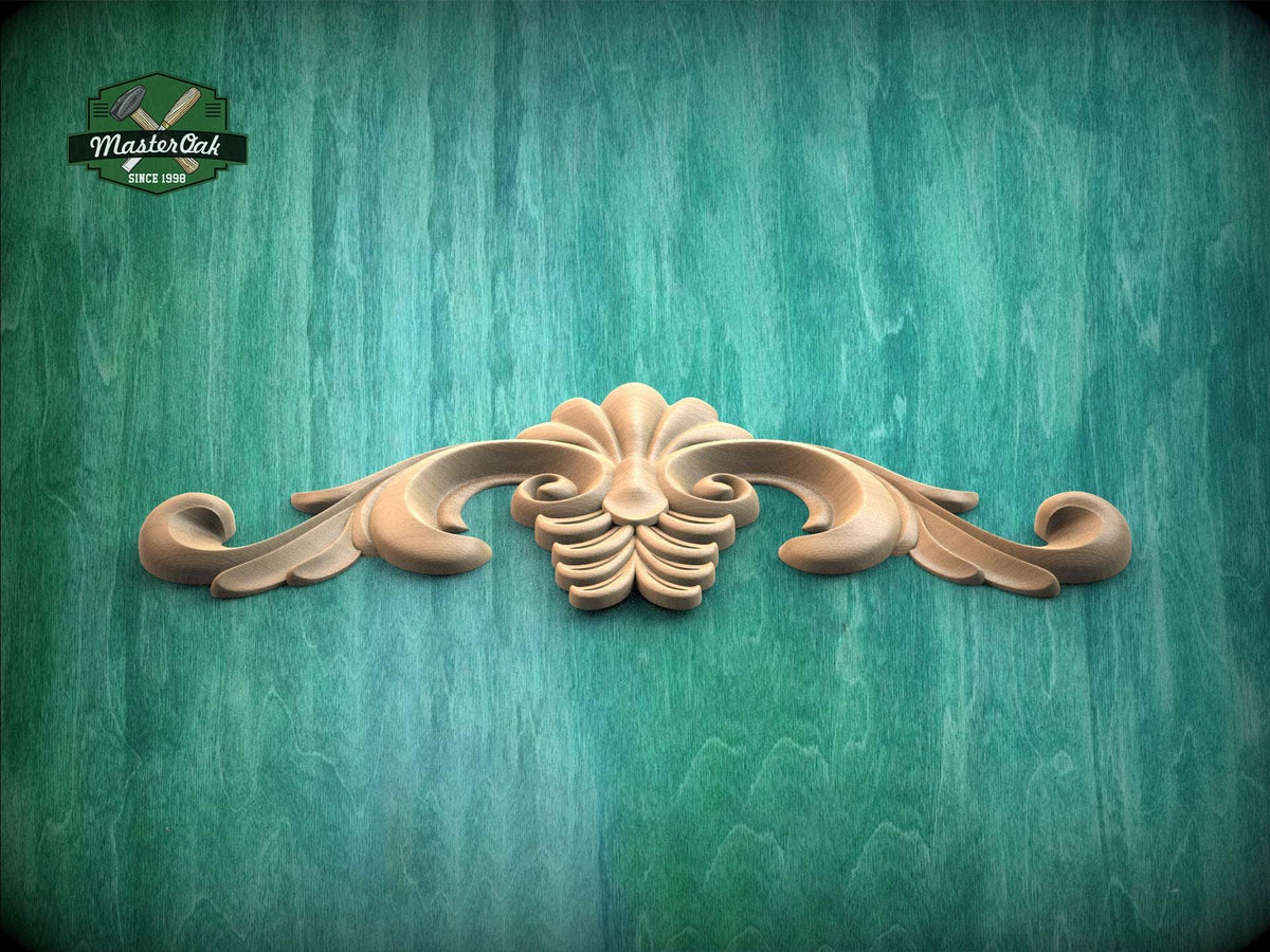 a wooden carving of a flower on a green background