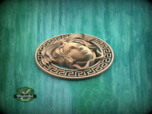 Load image into Gallery viewer, A wooden carving of a woman&#39;s face is displayed on a green background, surrounded by a decorative border.
