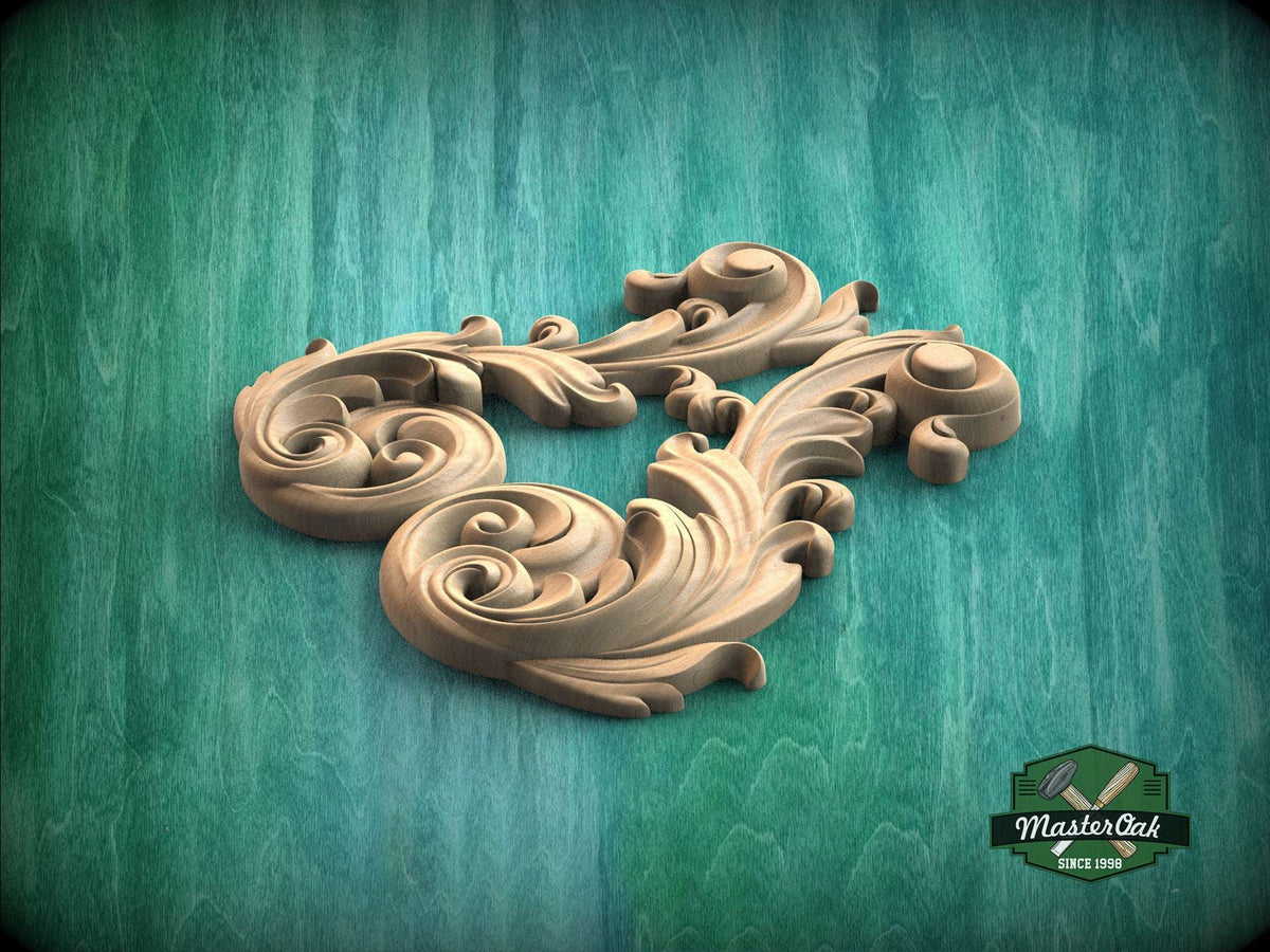 A wooden carving of a stylized leaf or flower design is displayed against a green background.