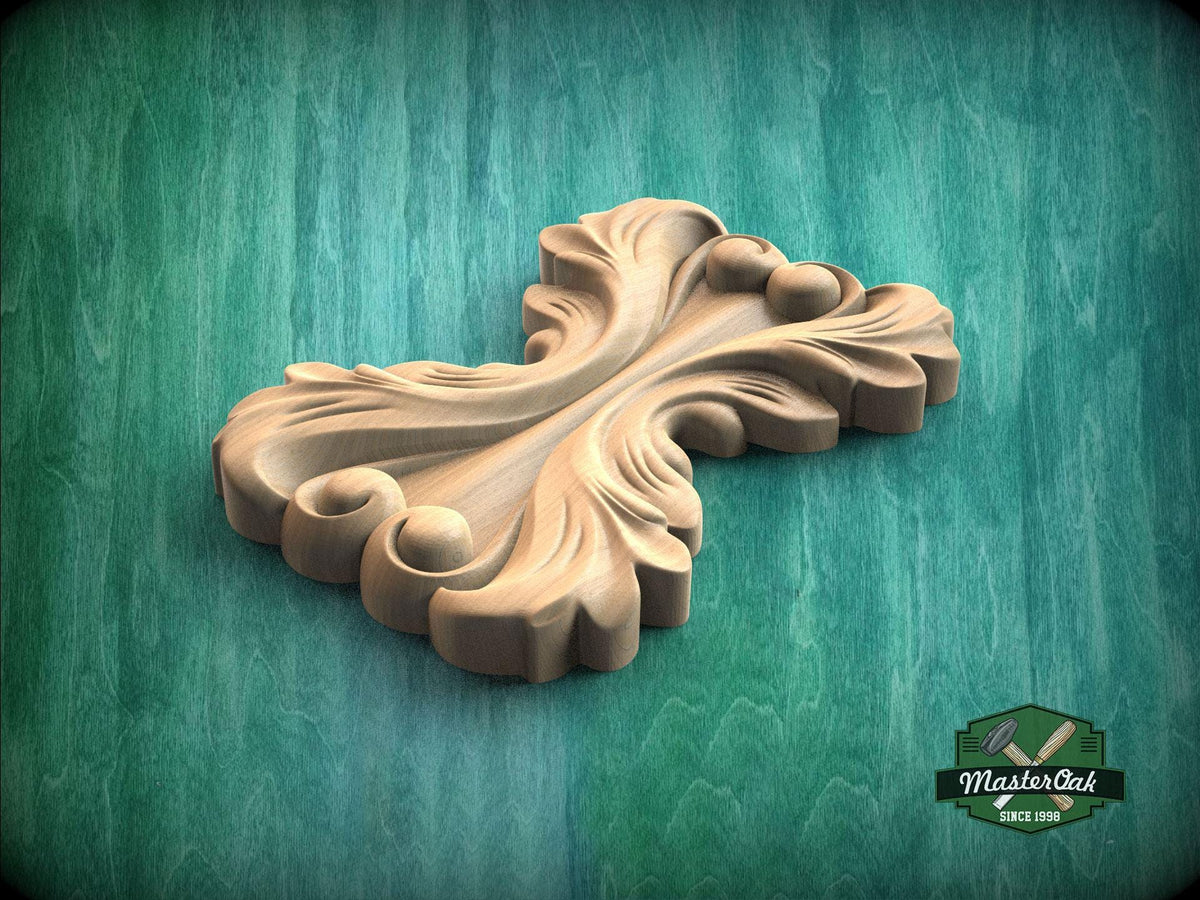 A wooden carving with a floral design is displayed against a green background.