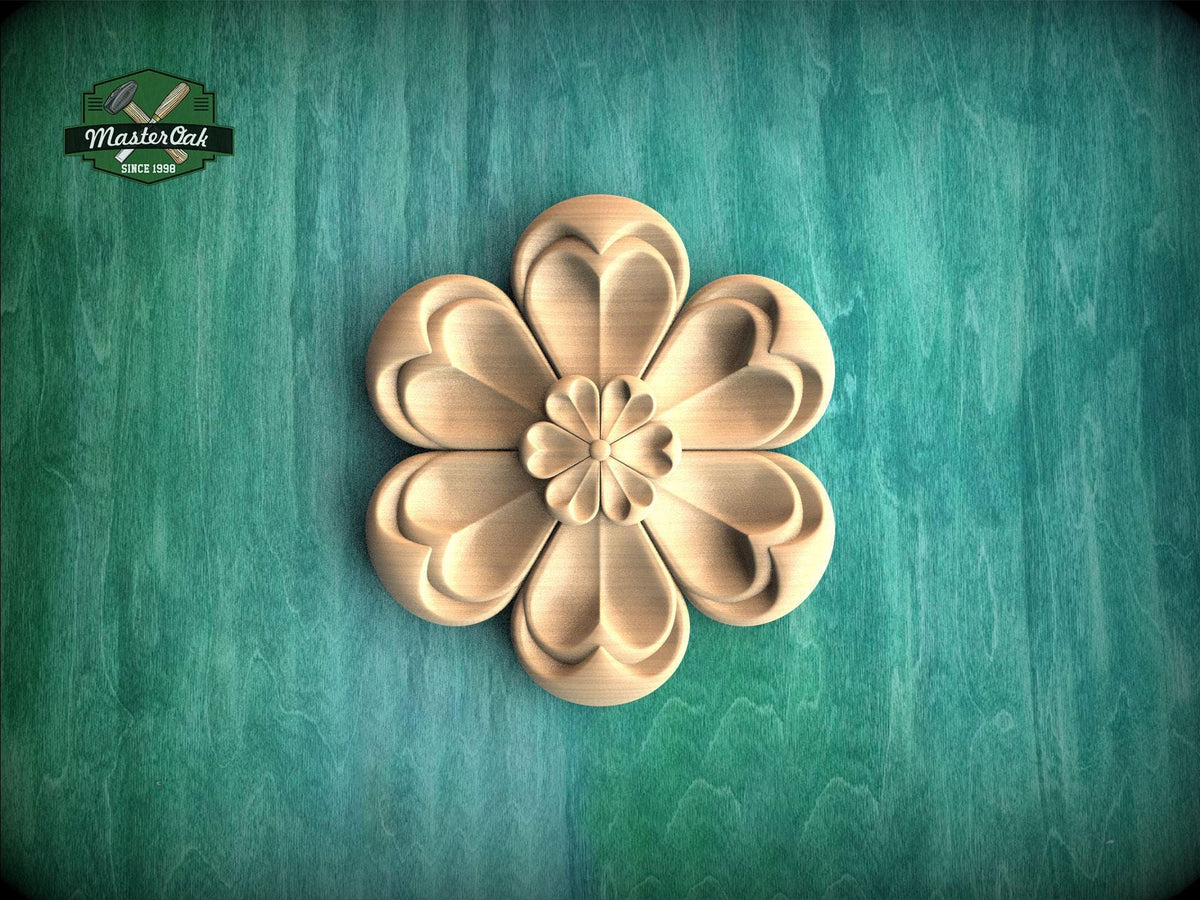 A wooden flower-shaped carving is prominently displayed against a green background.