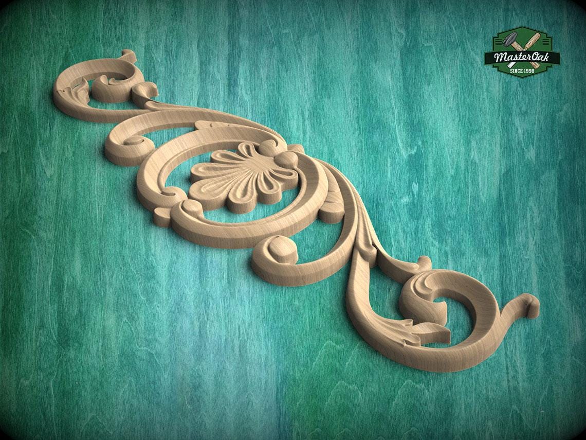 A decorative wooden carving with an intricate floral design is displayed against a teal background.