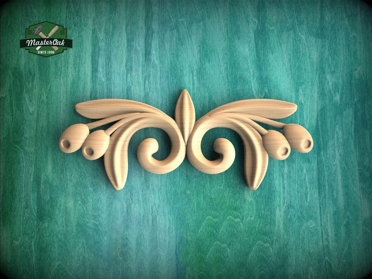 A decorative wooden carving in the shape of a stylized flower or leaf design is displayed against a green textured background.