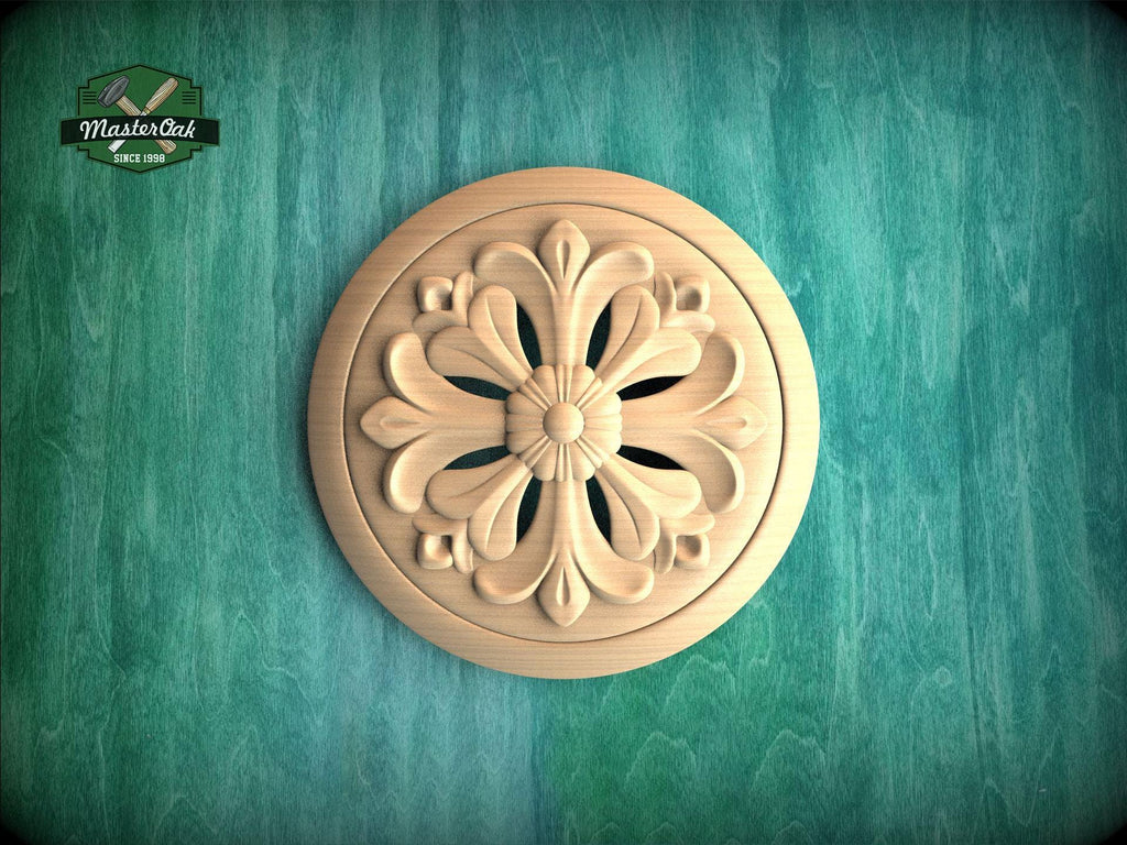 A wooden ornamental piece with a floral design is displayed against a green textured background.