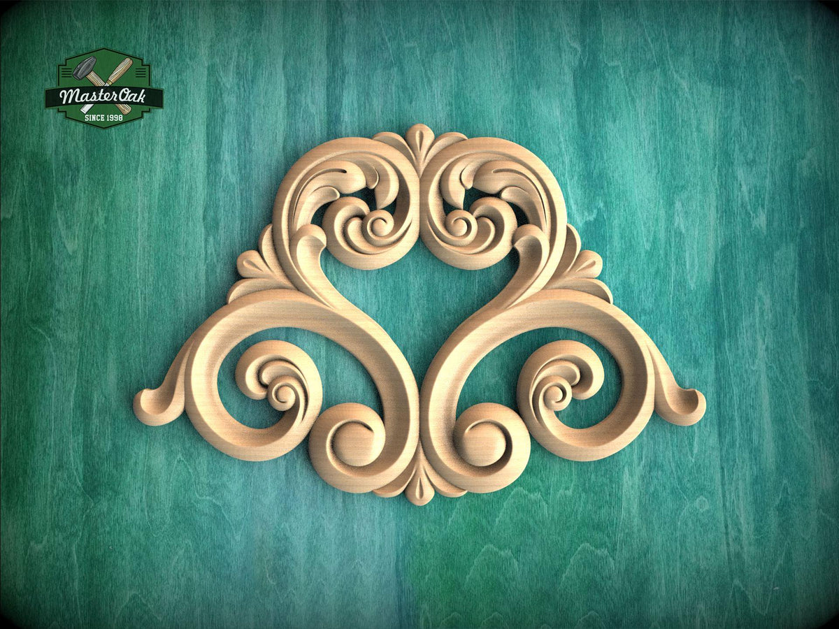 an ornate, carved wooden design with intricate scrollwork and floral patterns, set against a green background.