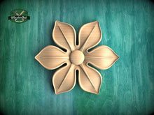Load image into Gallery viewer, A wooden flower carving is displayed against a green background.
