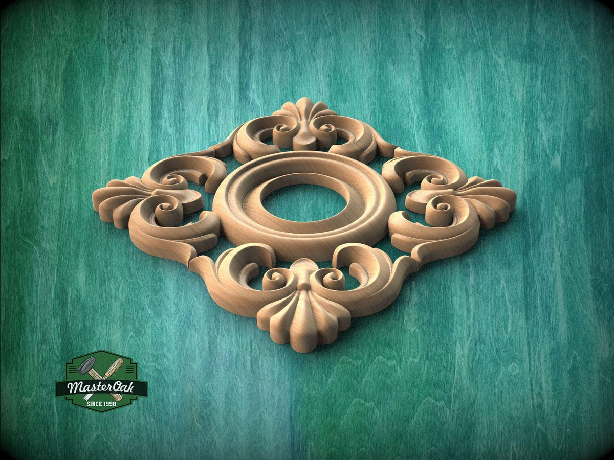 A decorative wooden panel with an ornate floral design, featuring a central circular motif surrounded by intricate scrollwork.