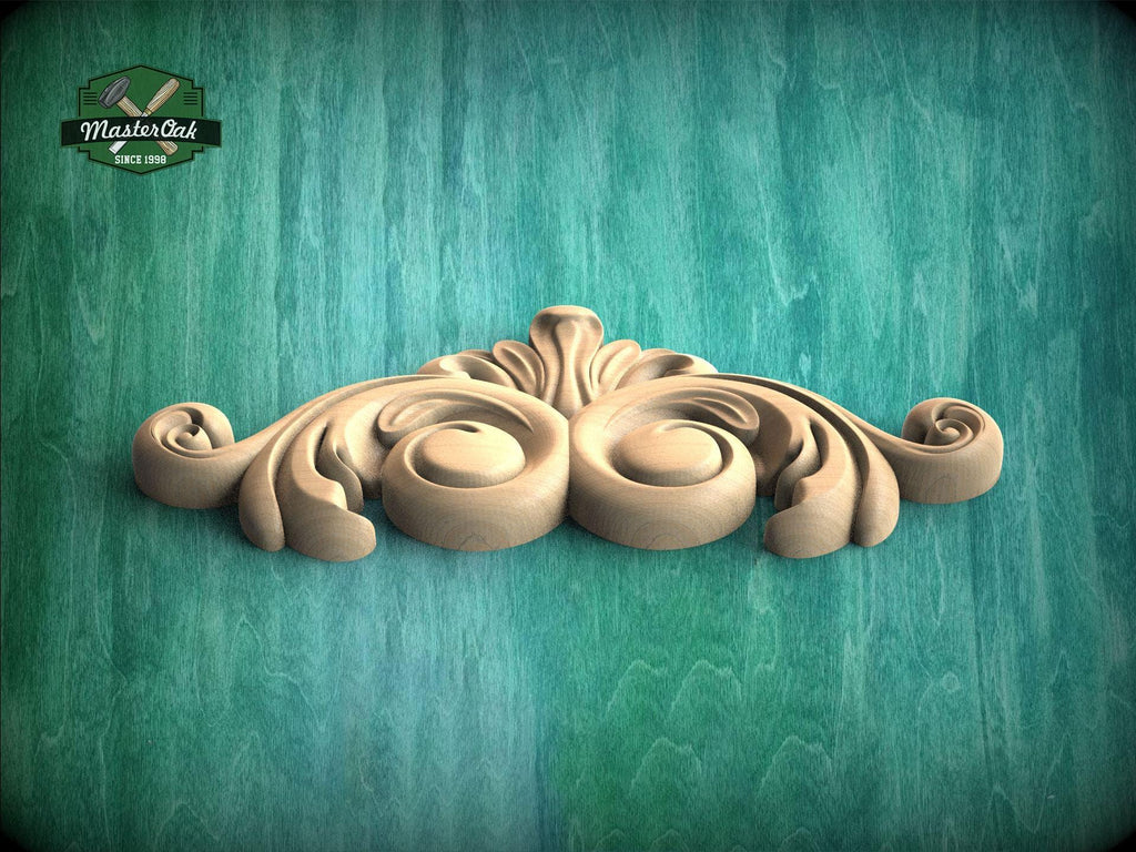 A decorative wooden carving with an ornate, swirling design is displayed against a green wooden background.