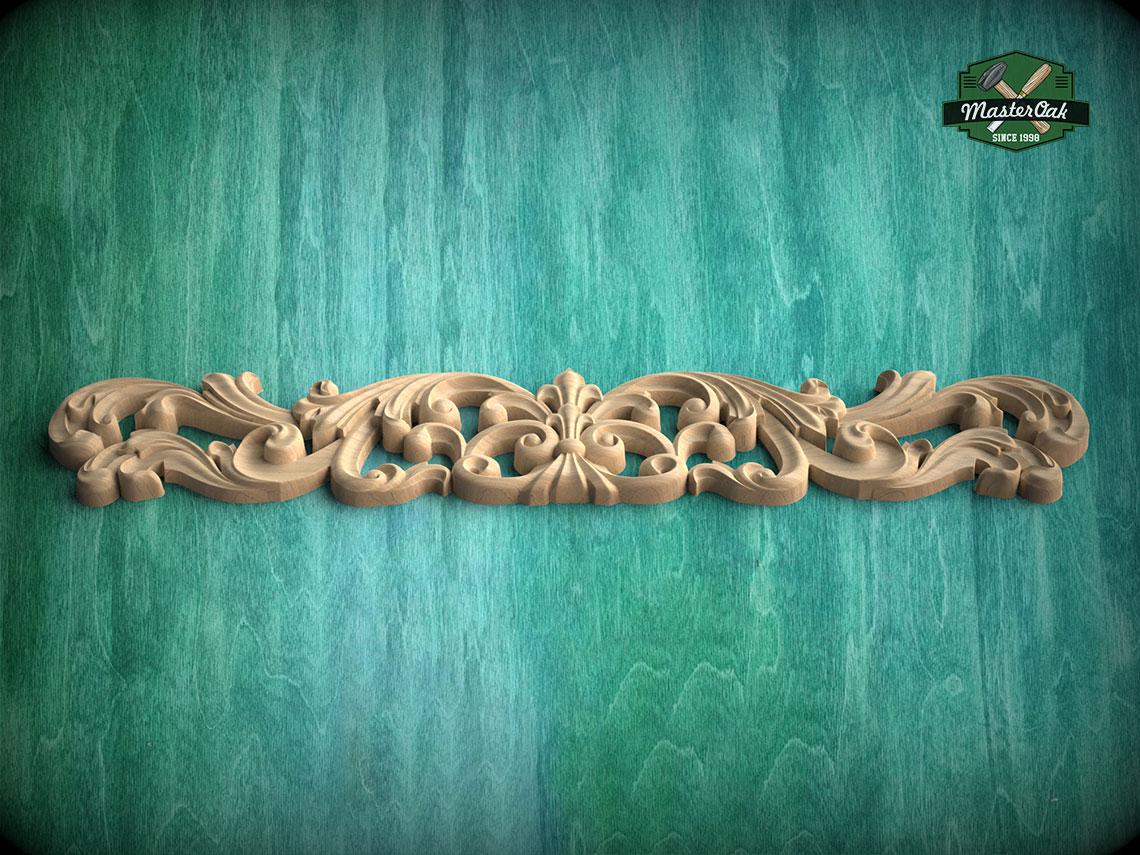 A decorative wooden carving with intricate scrollwork is displayed against a green textured background.