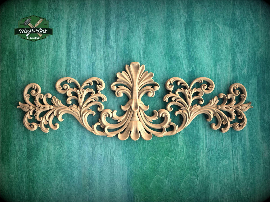 an ornate, carved wooden design with intricate scrollwork and floral patterns, set against a green textured background.