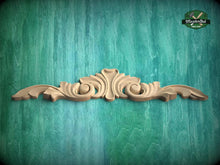 Load image into Gallery viewer, A decorative wooden carving is displayed against a teal-colored background.
