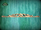 a wooden shelf with a decorative design on it