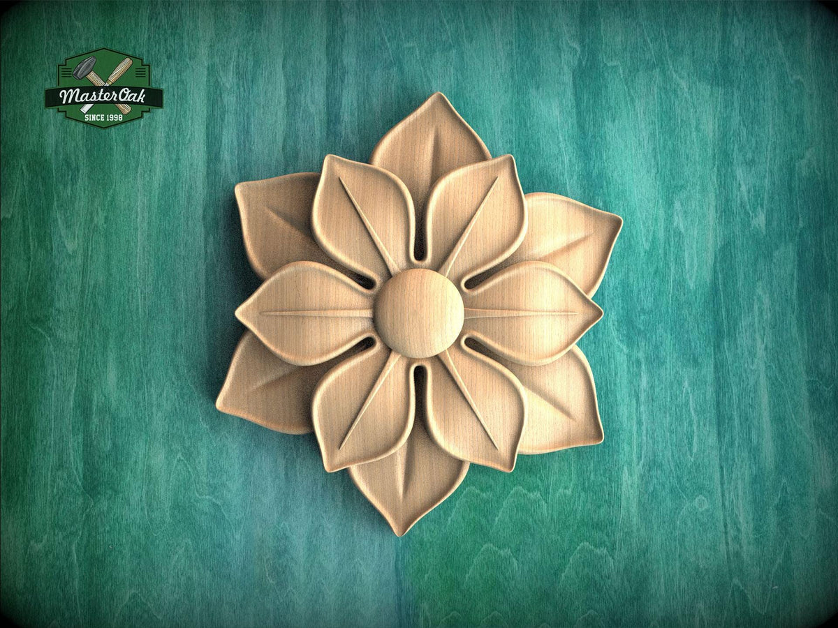 A wooden flower carving is displayed against a green background.