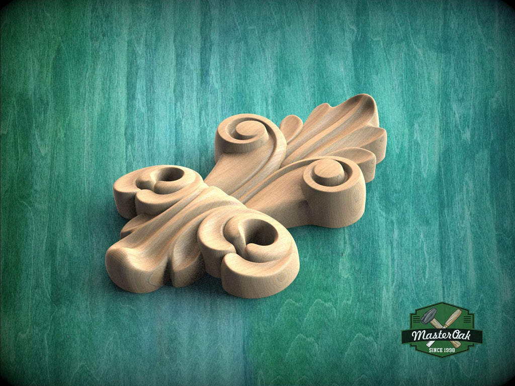 A wooden carving of a leaf-like design is displayed against a green background.