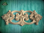 a beautifully carved wooden piece with intricate designs, displayed against a green background.