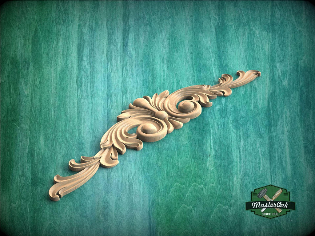 a wood carving of an ornate design on a green background