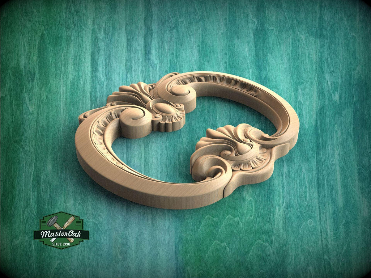 A wooden ornate handle or knob with intricate scrollwork and floral designs, resting on a green textured background.
