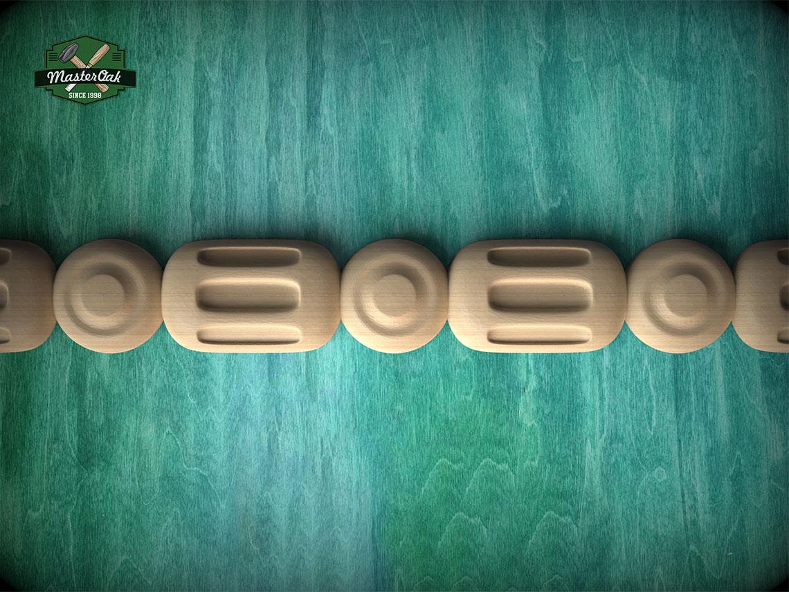 A row of wooden objects, possibly carved or shaped, arranged on a green textured background.