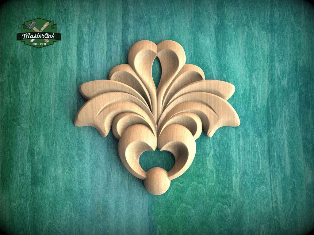 a decorative wooden carving on a green background.