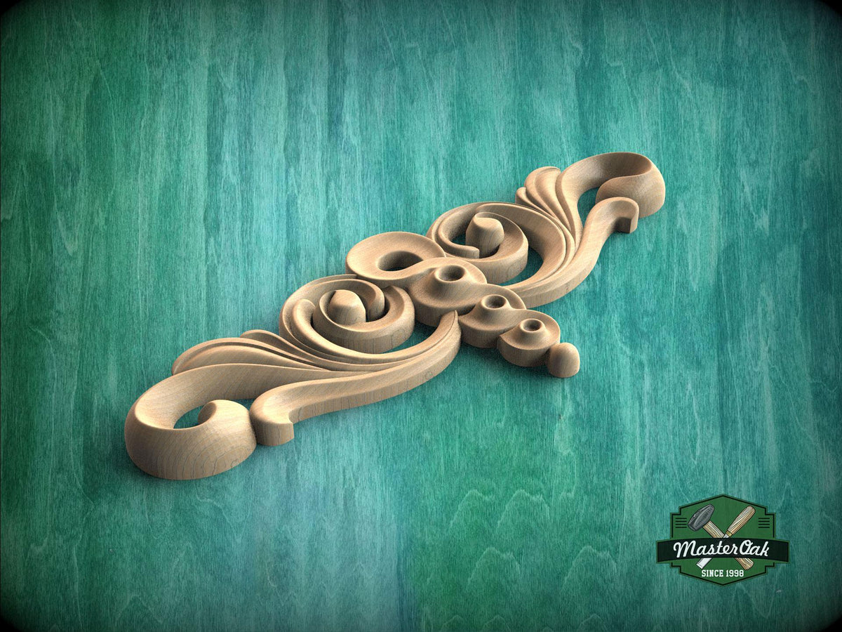 A decorative wooden carving with intricate swirls and curves is displayed against a teal-colored background.