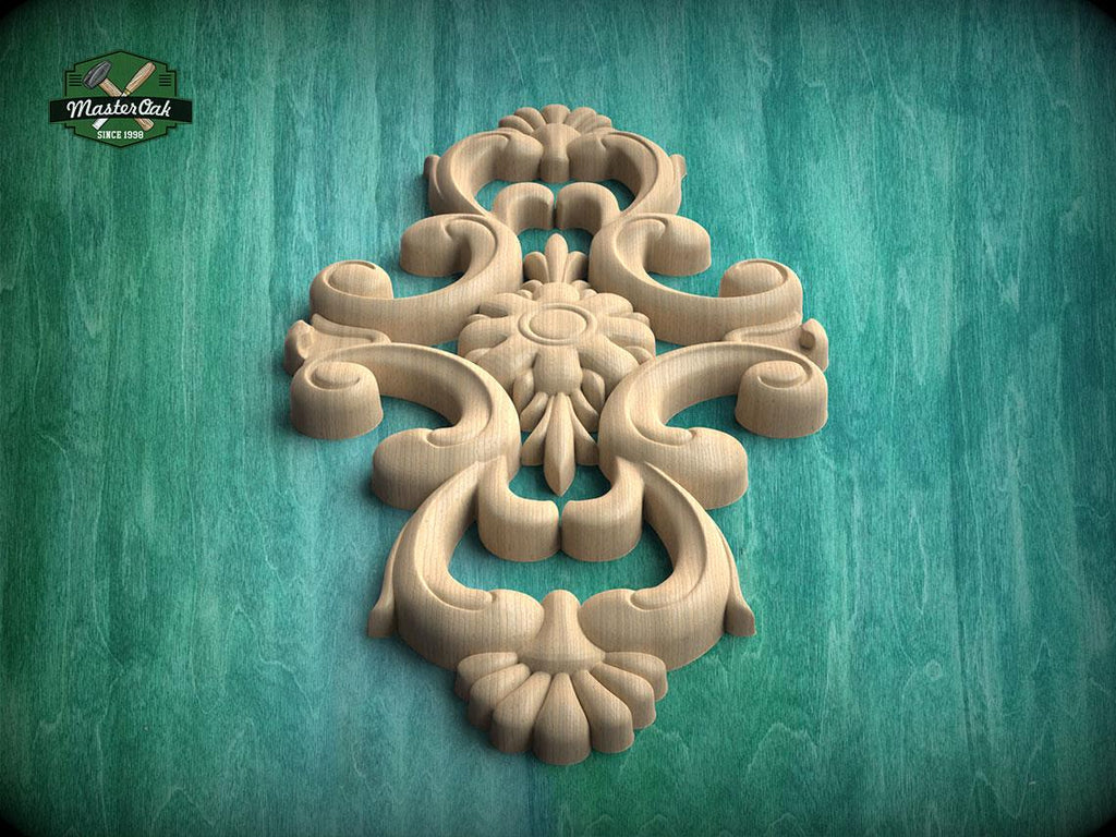 a decorative wooden carving with intricate floral and scrollwork designs, set against a green background.