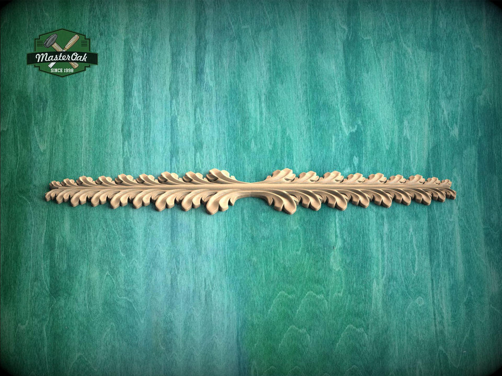 A decorative wooden leaf-like object is displayed against a green textured background.
