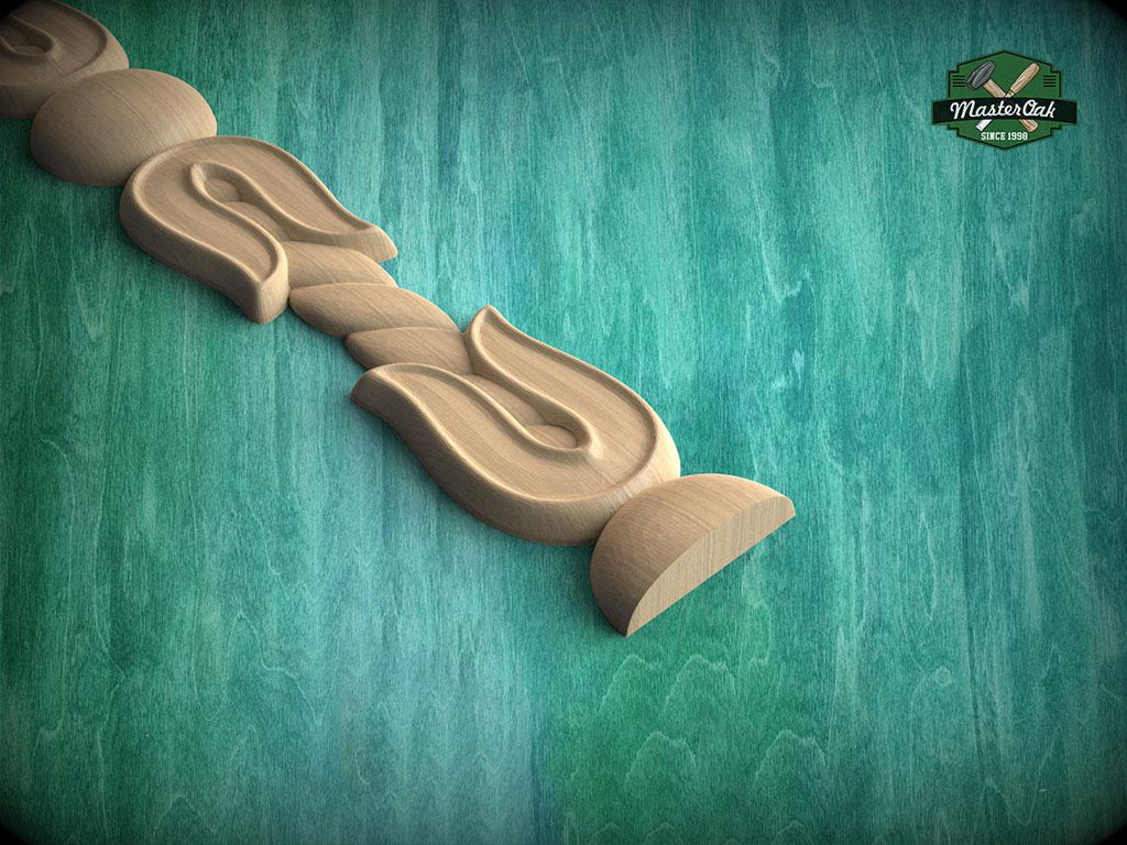 A wooden carving of a flower-like design is displayed against a green background.