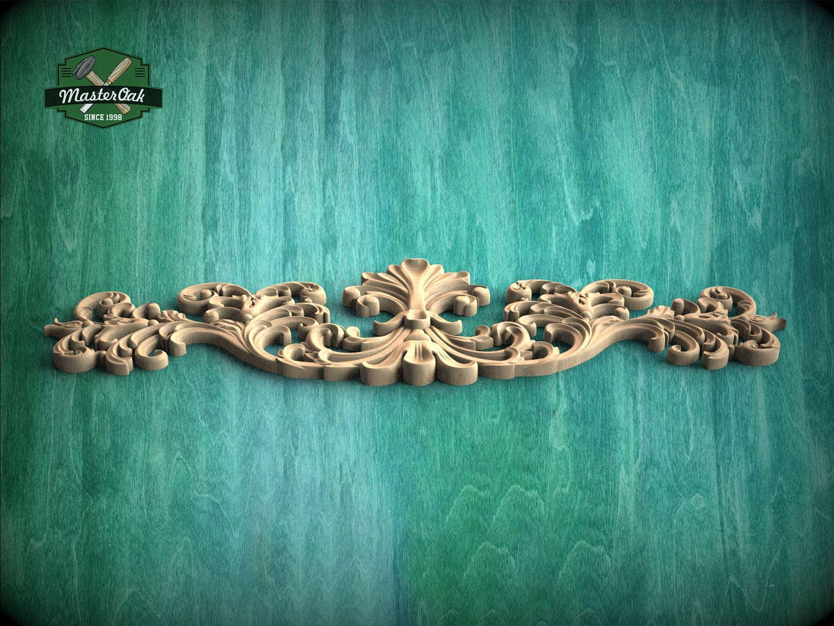 A decorative wooden carving with intricate scrollwork is displayed against a textured green background.