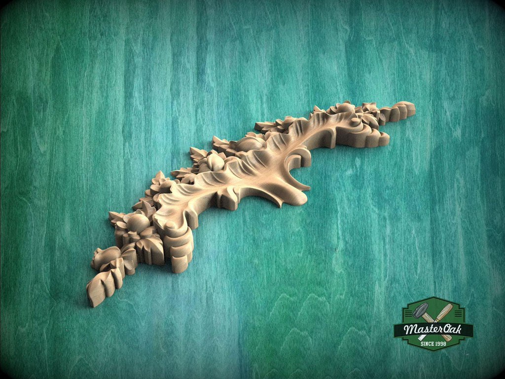 A decorative wooden carving with intricate leaf and flower designs is displayed against a green background.