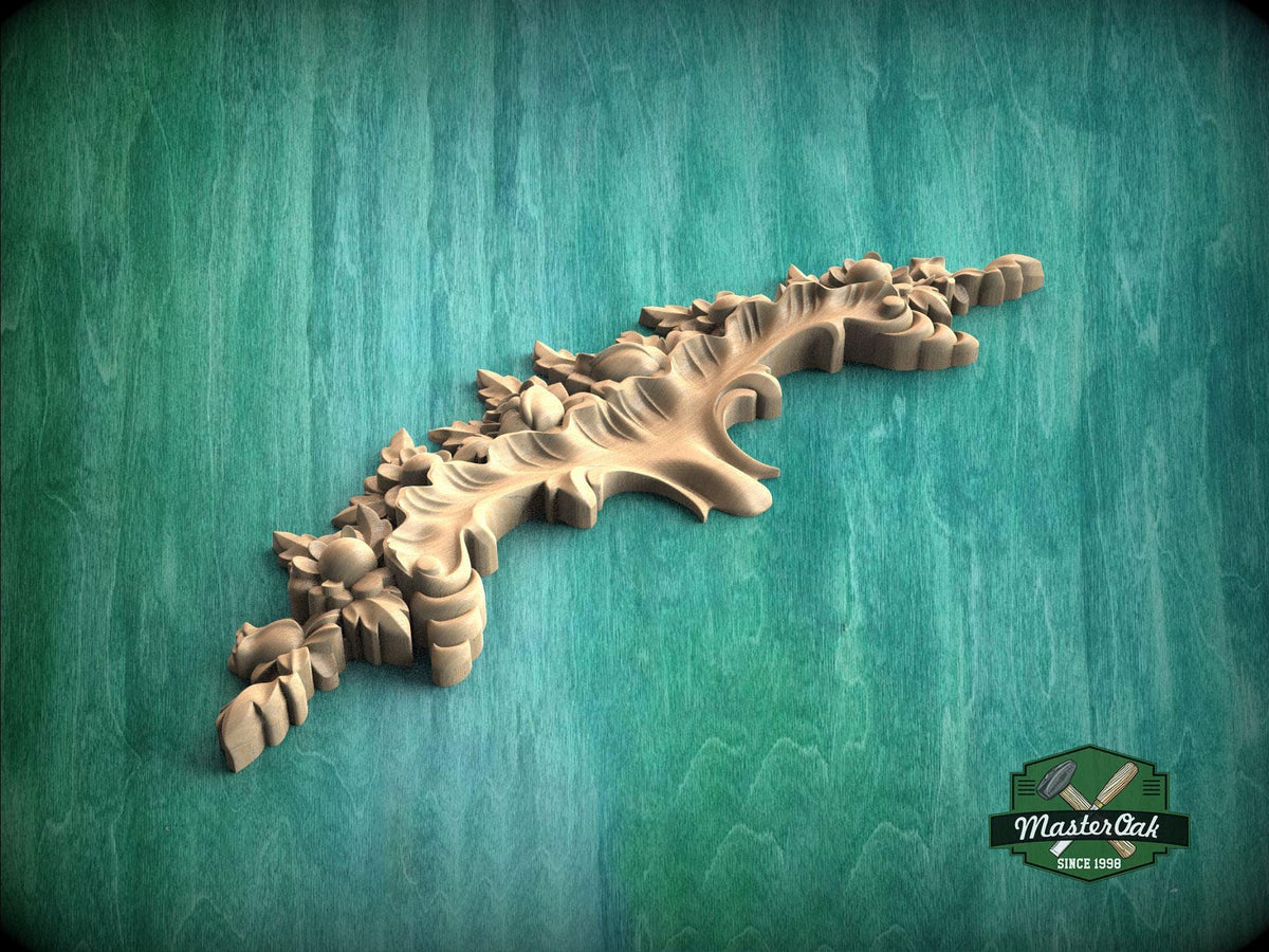 A decorative wooden carving with intricate leaf and flower designs is displayed against a green background.