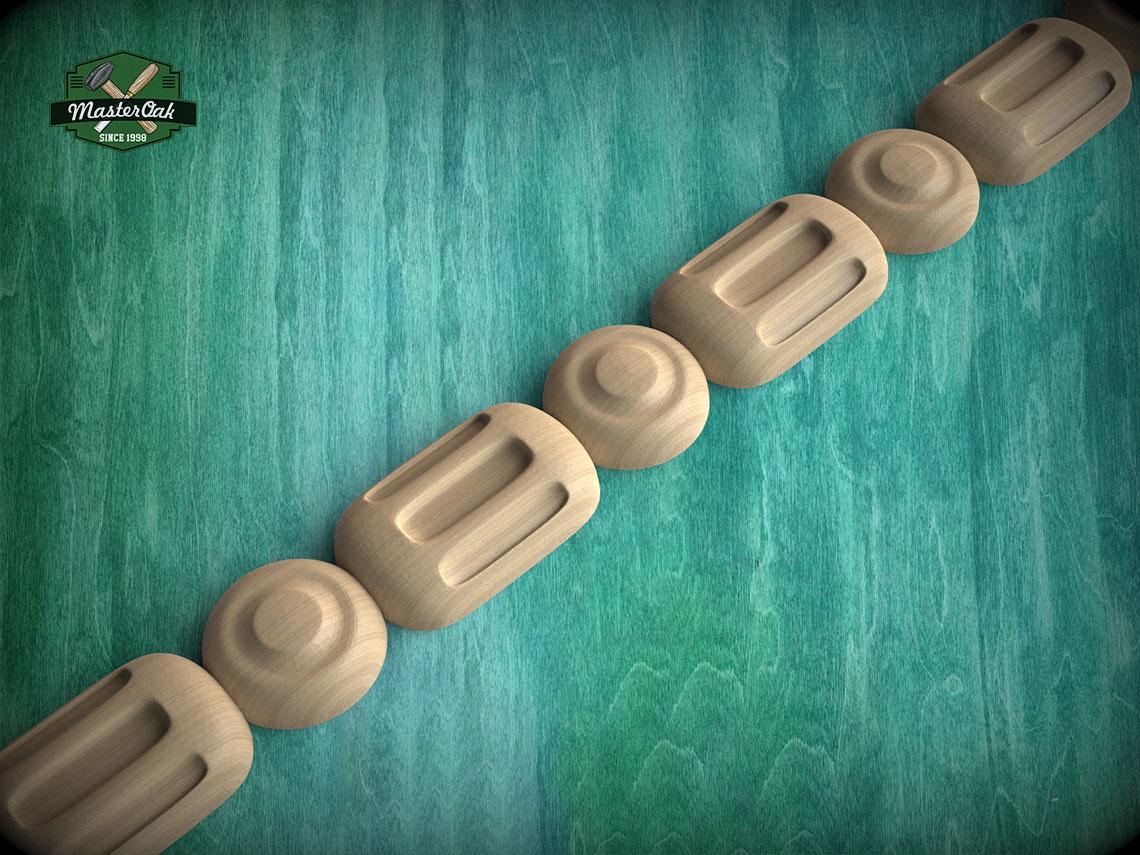 A row of wooden objects, possibly carved or shaped, arranged in a linear fashion against a green background.