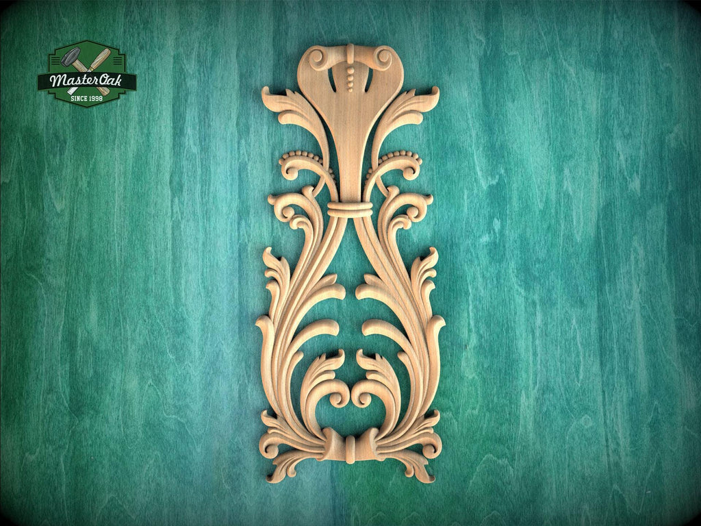 a decorative wooden carving on a green background.