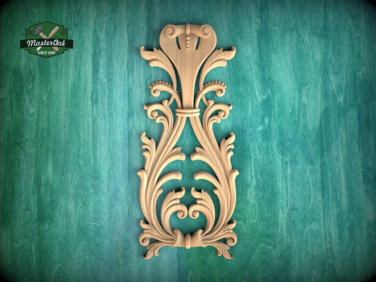 a decorative wooden carving on a green background.