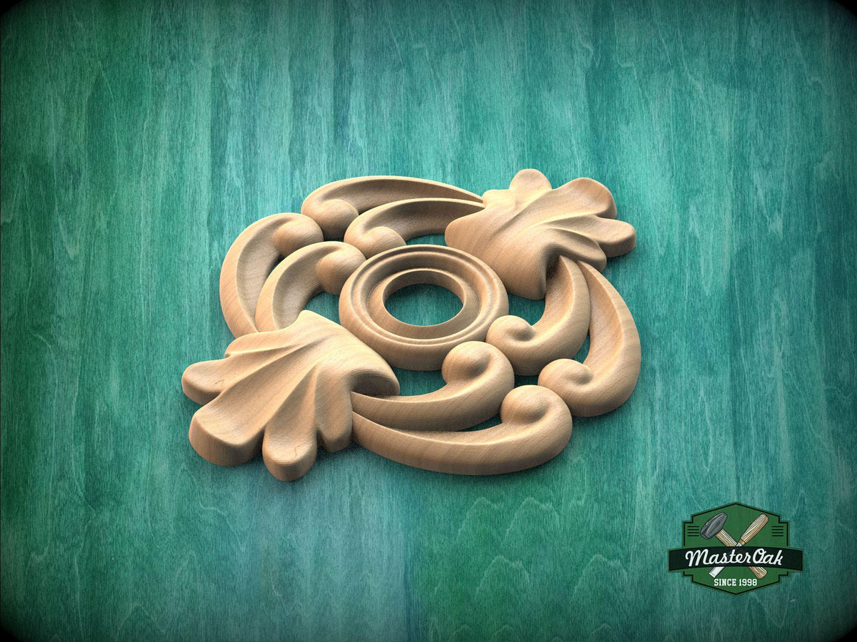 A wooden carving with intricate floral designs is displayed against a green background.