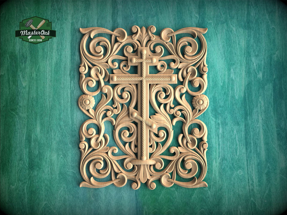 an ornate, carved wooden cross with intricate floral and scroll designs, set against a teal background.