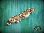 a carved wooden object on a green background