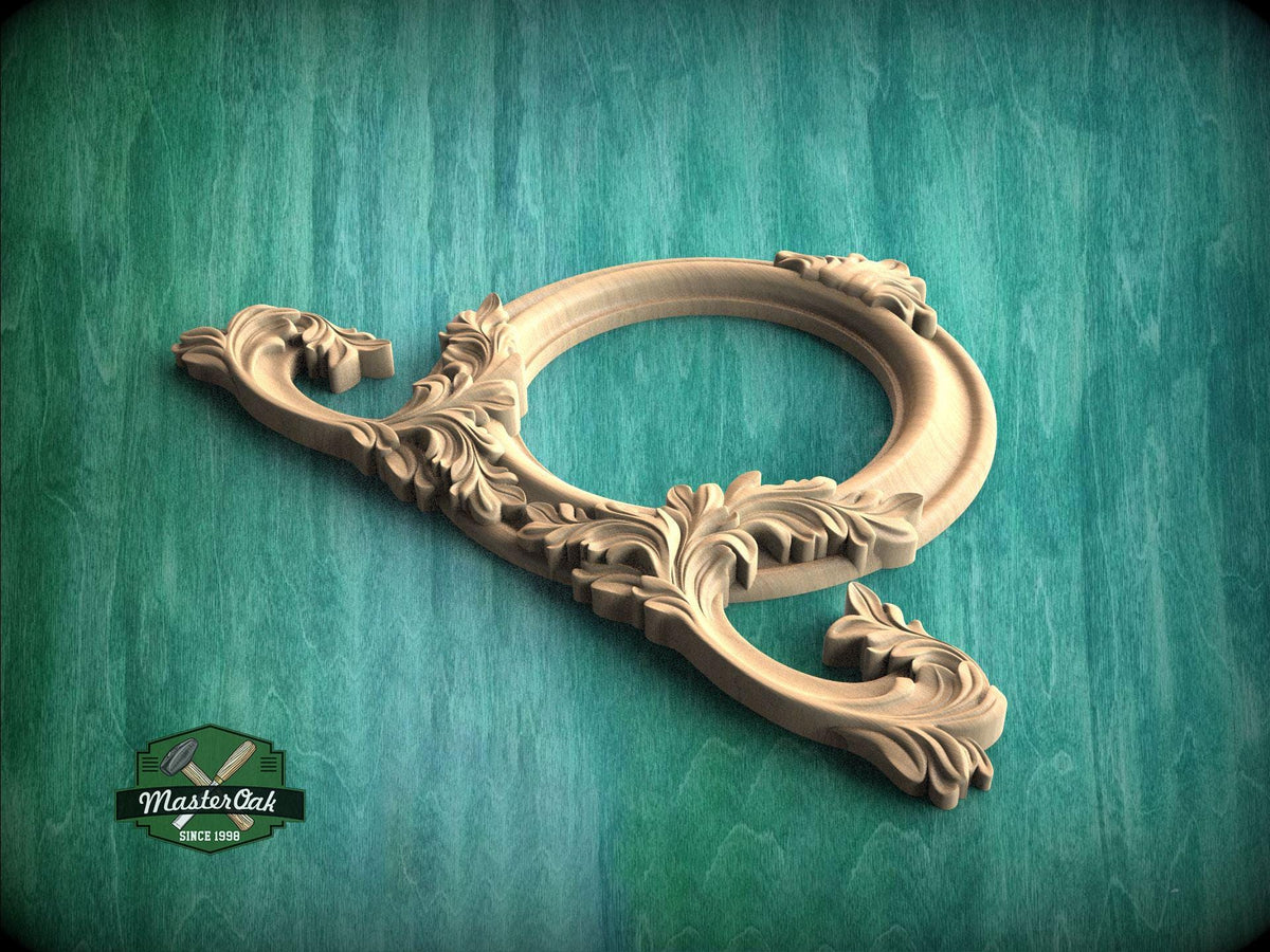 A wooden ornate frame with intricate carvings is displayed against a green background.