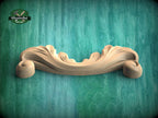 A wooden carving with a curved, ornate design is displayed against a teal-colored background.
