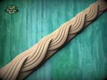 Load image into Gallery viewer, A wooden decorative element with a curved, wavy design is displayed against a green background.
