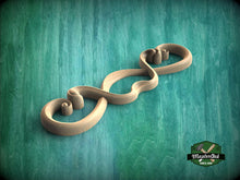 Load image into Gallery viewer, A wooden scrollwork design with a curved shape and a textured surface, set against a green background.
