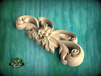 A decorative wooden carving with intricate floral and leaf designs is displayed against a green textured background.