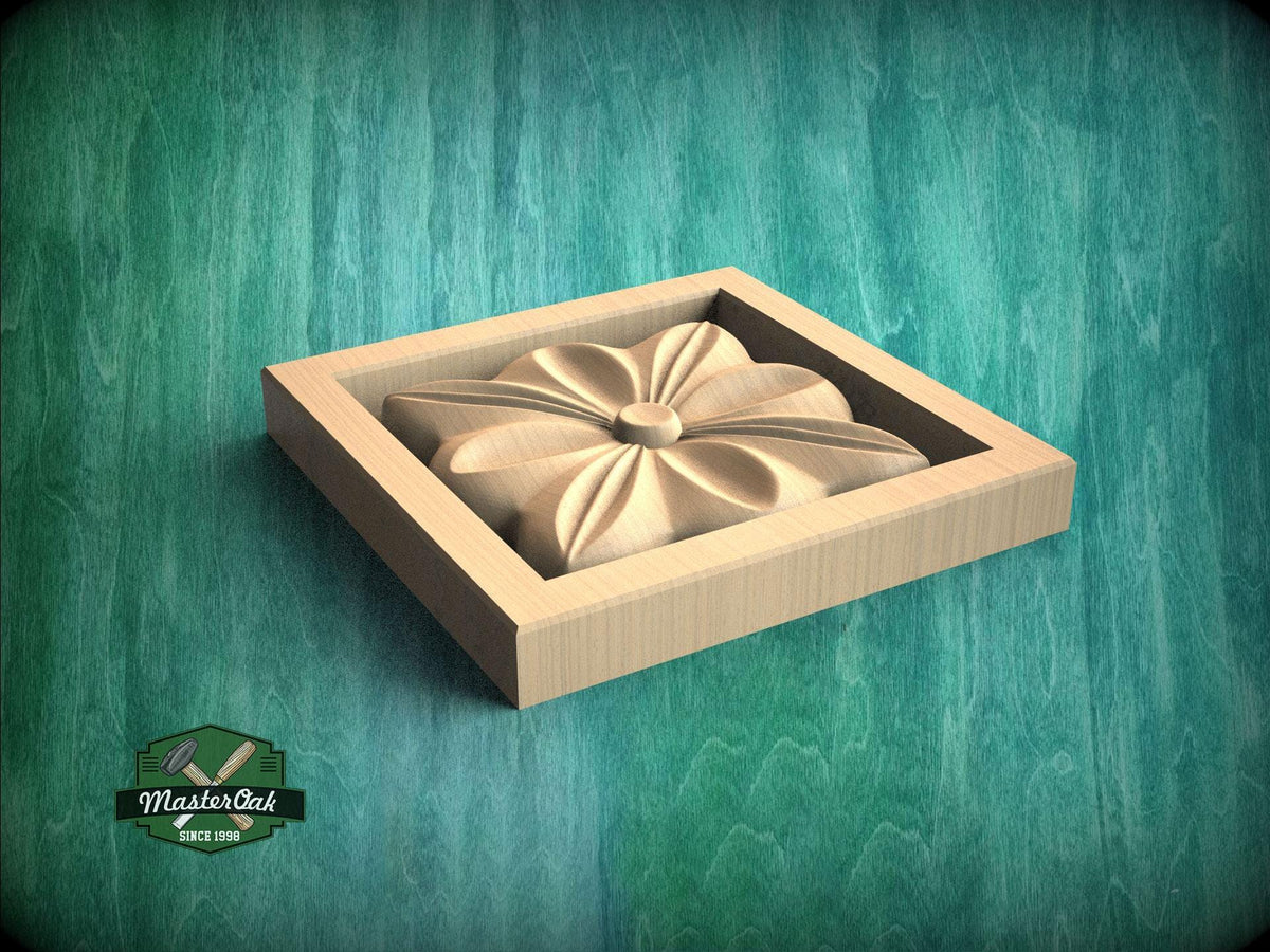 A wooden box with a carved flower-like design on its side, set against a green textured background.