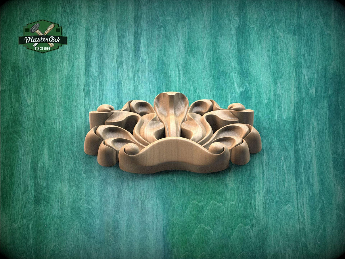 A wooden carving of a stylized flower or plant design is displayed against a green textured background.