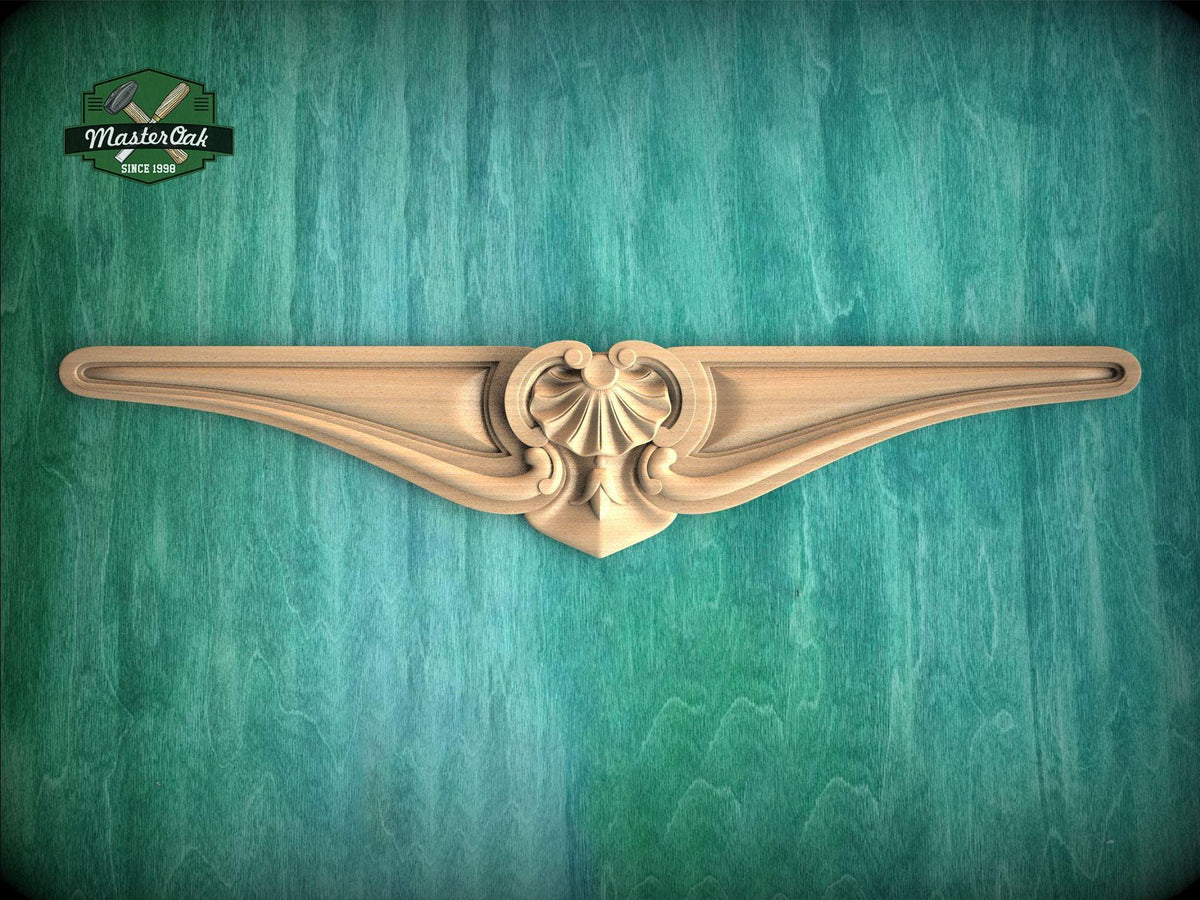 A decorative wooden molding with an ornate design is displayed against a green textured background.