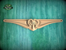 Load image into Gallery viewer, A decorative wooden molding with an ornate design is displayed against a green textured background.
