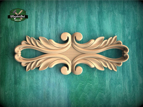 a decorative wooden carving on a green background.