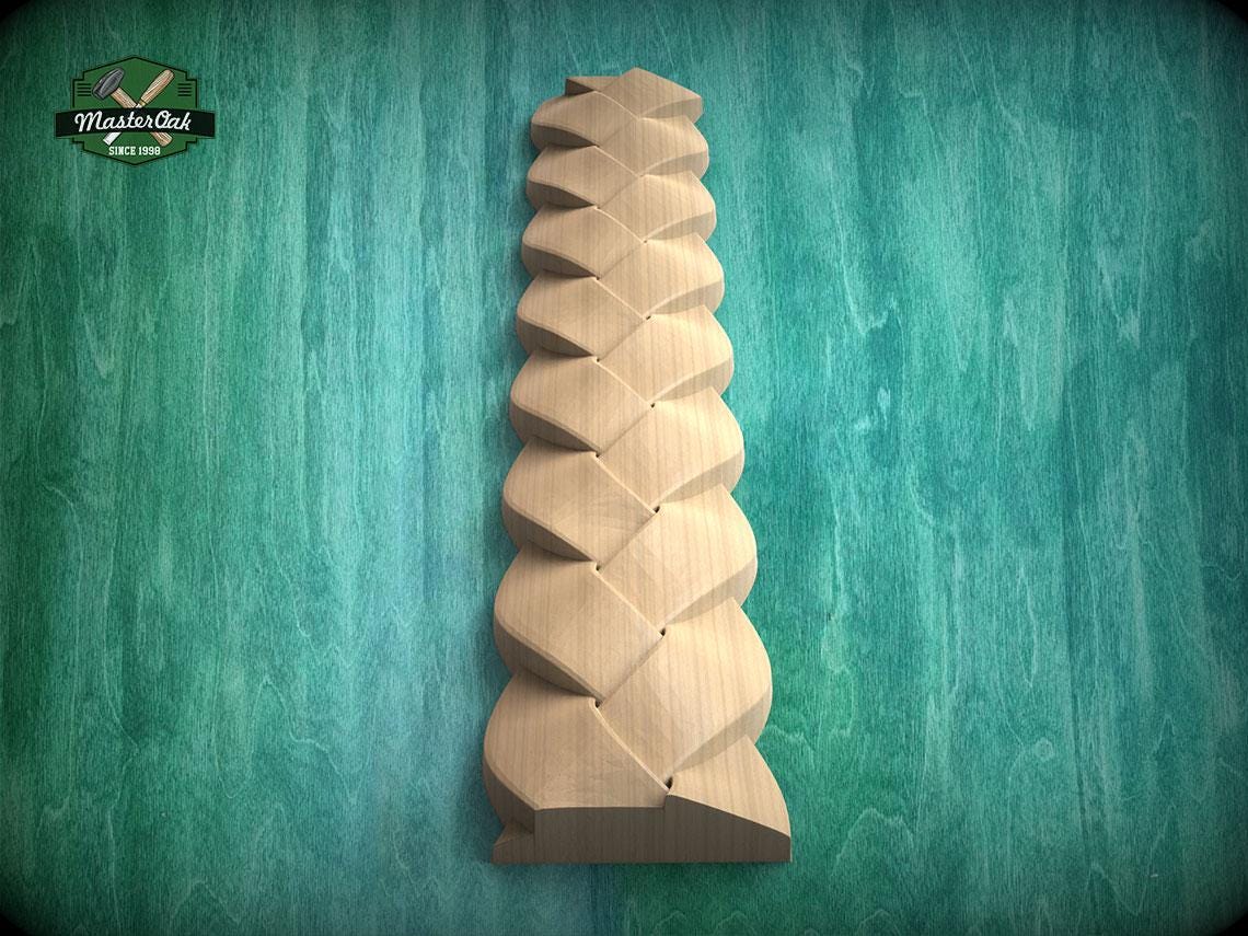 A wooden sculpture with a unique, intricate design is displayed against a green background.