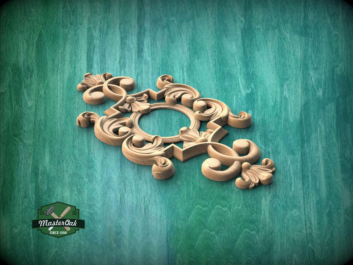 A decorative wooden carving with intricate scrollwork and floral elements is displayed against a green wooden background.